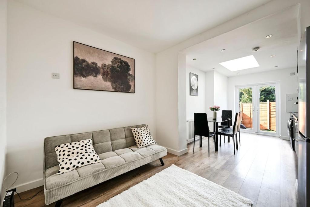 a living room with a couch and a dining room at Two bedrooms apartment in Wainscot
