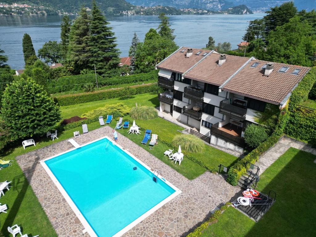 an aerial view of a house with a swimming pool at Prati Escape - Apartment with Pool and Lakeview in Lierna