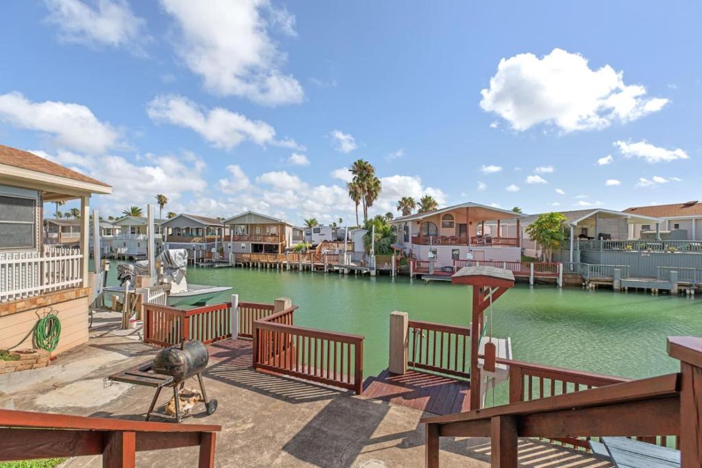 a view of a body of water with houses at Bonnet Sea Cottage on the water- LIV Resort in Port Isabel