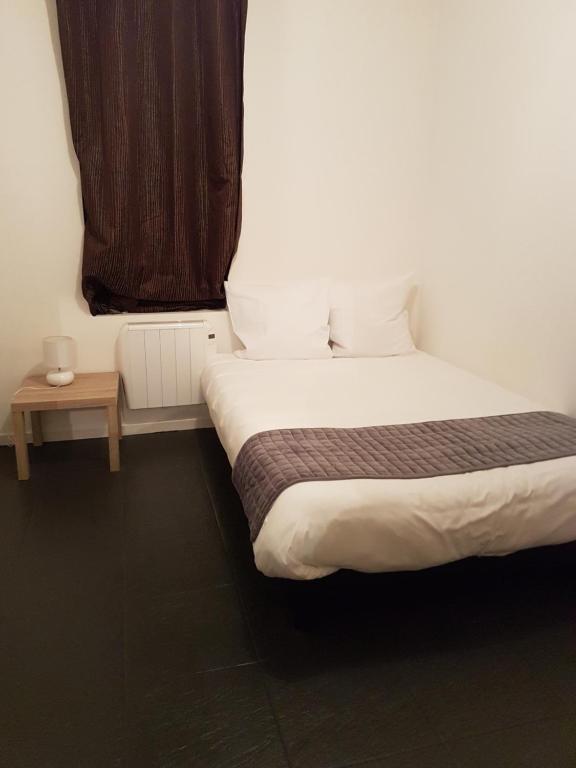 Postel nebo postele na pokoji v ubytování Hotel Morez