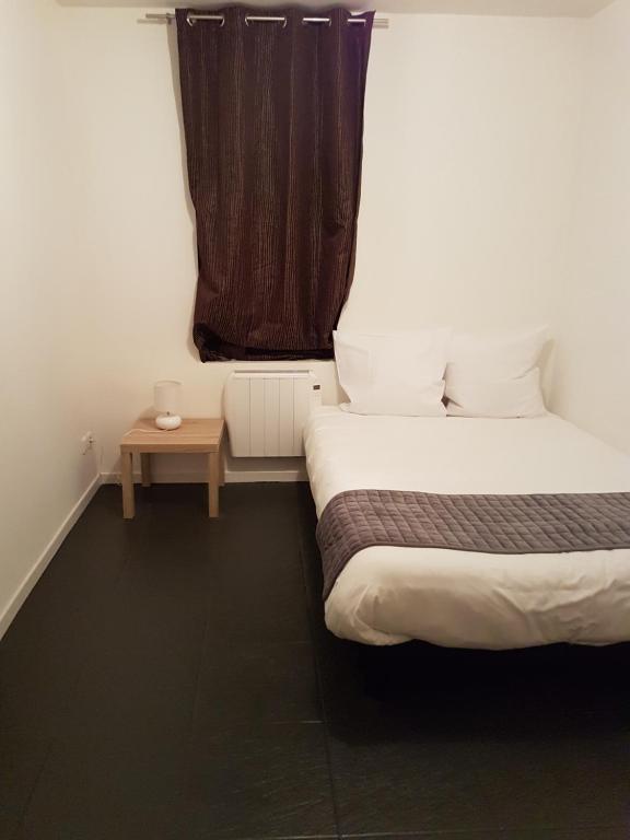 Postel nebo postele na pokoji v ubytování Hotel Morez