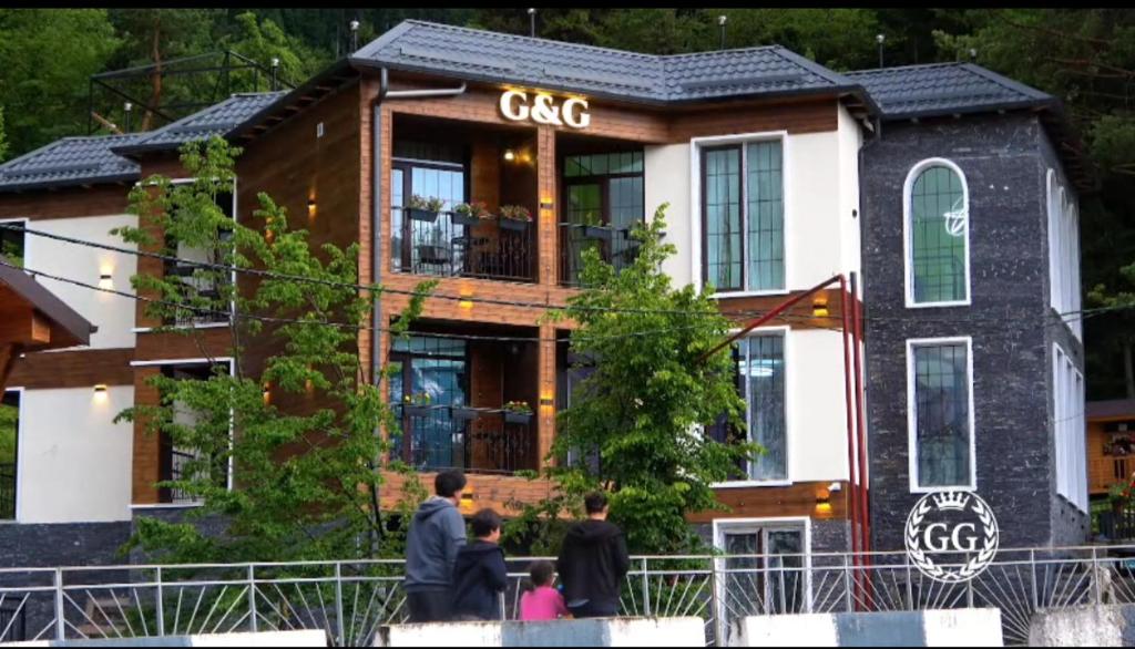a building with people standing in front of it at Hotel G&G in Tsaghveri