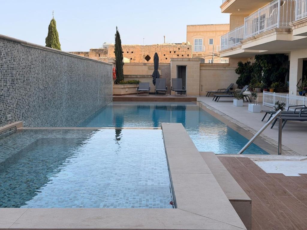 a swimming pool in the middle of a building at B6 Dahlet Ta Cenc in Sannat