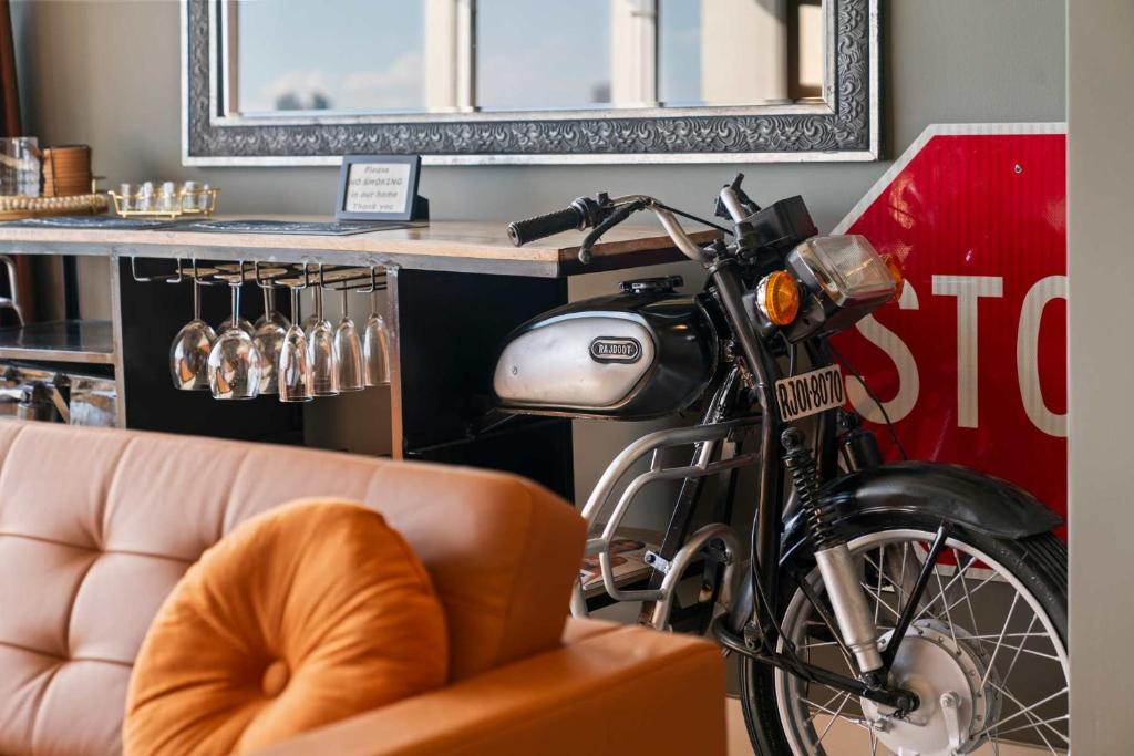 a motorcycle parked next to a bar with a couch at Hollywood Beach Speakeasy Condo with Pool in Hollywood