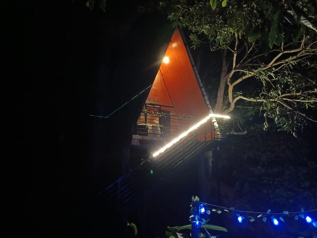 a sail boat with lights on it at night at Cabaña la Valkiria in Falan