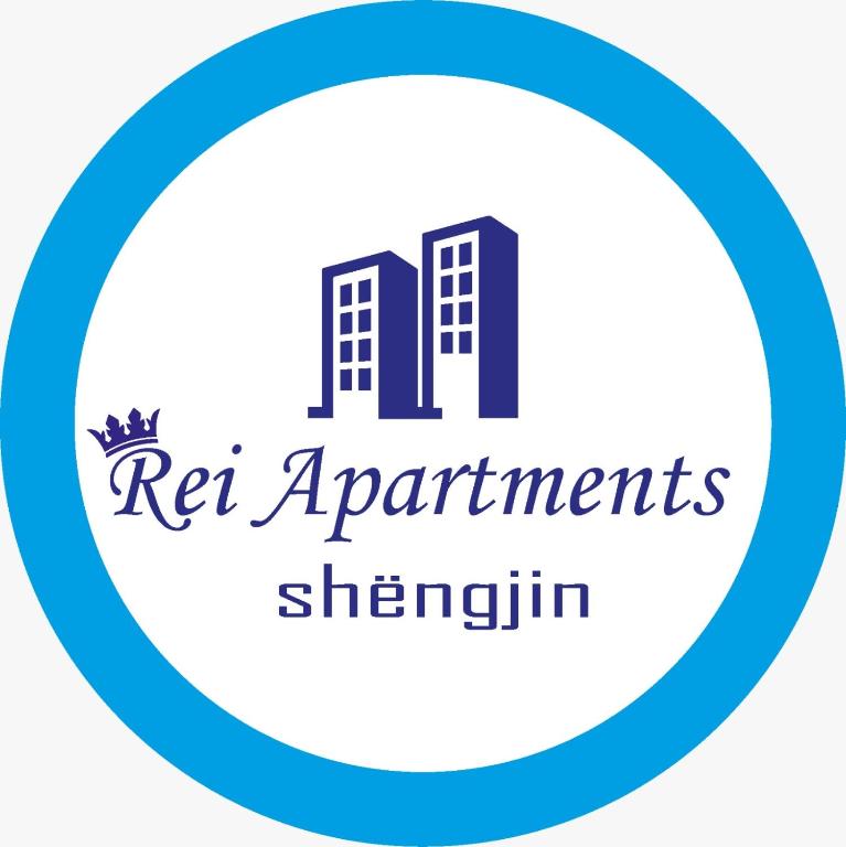 a sign for the ren apartment strengths sherrin logo at Rei Apartments Shengjin in Shëngjin