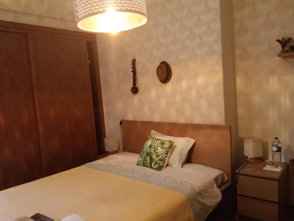 a bedroom with a bed with a pillow on it at Oeiras Central, near Beach & Public Transport in Oeiras