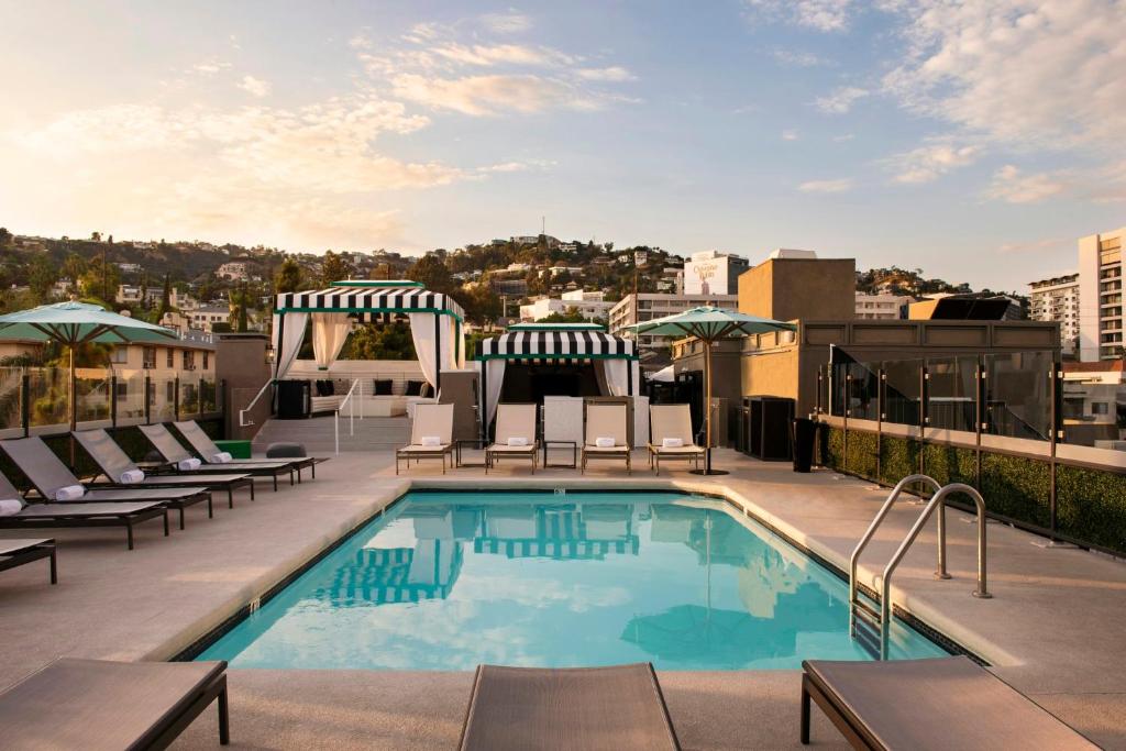 a swimming pool on the roof of a building at Chamberlain West Hollywood in Los Angeles