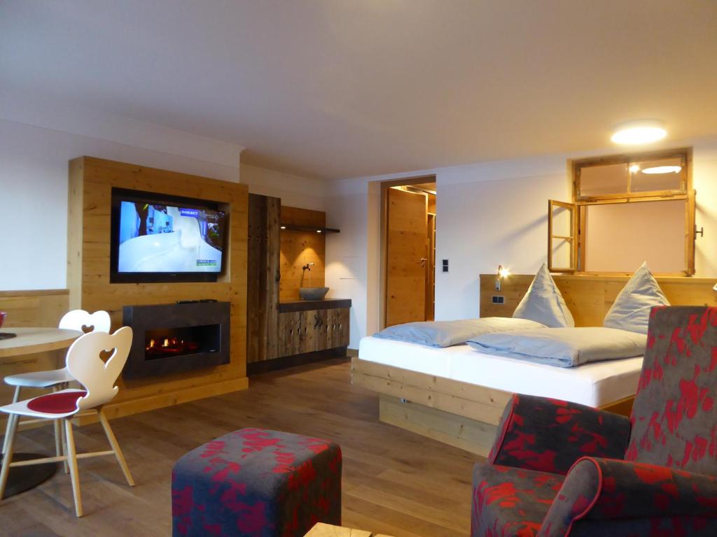 Postel nebo postele na pokoji v ubytování Dreimäderlhaus - Das vegetarische Boutique Hotel