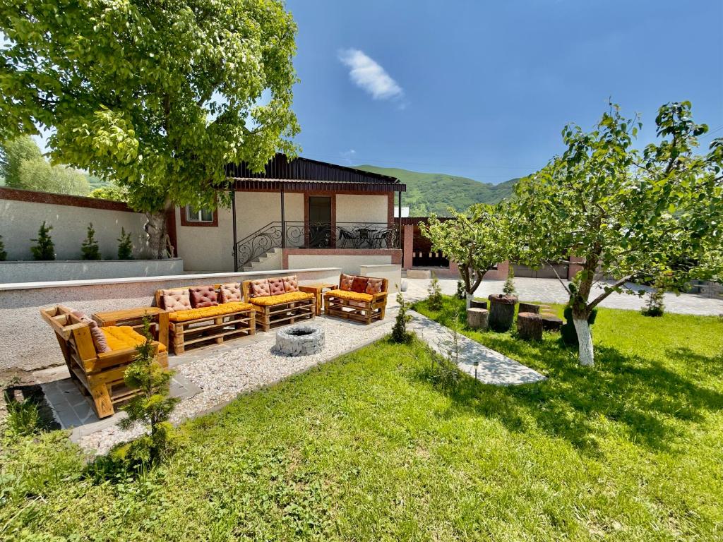 a patio with couches and chairs in a yard at Home Ler in Yeghipatrush
