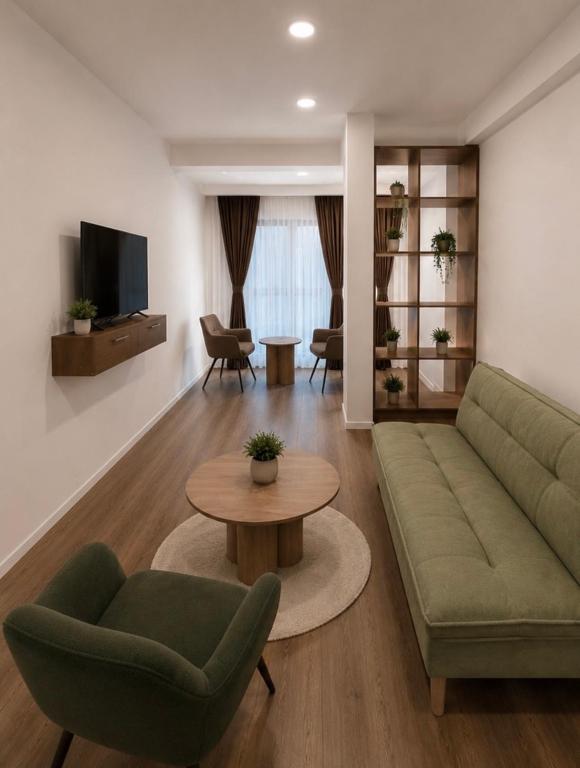 a living room with a couch and a table at Euro Hotel in Peje