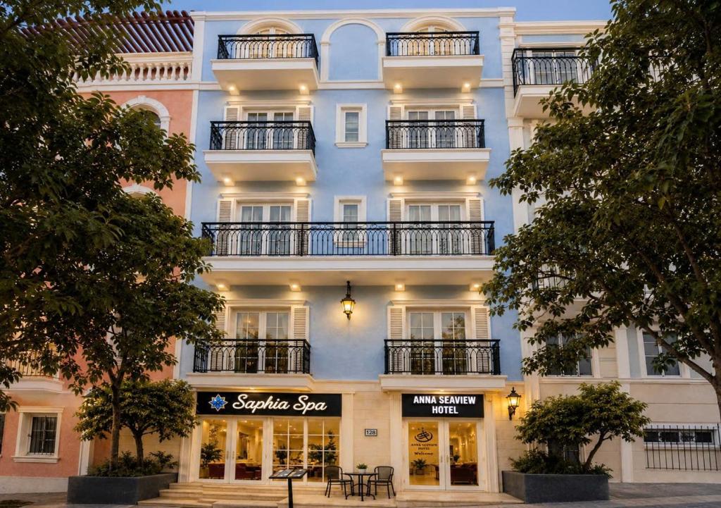 a large white building with a sign in front of it at Anna seaview hotel in Phú Quốc