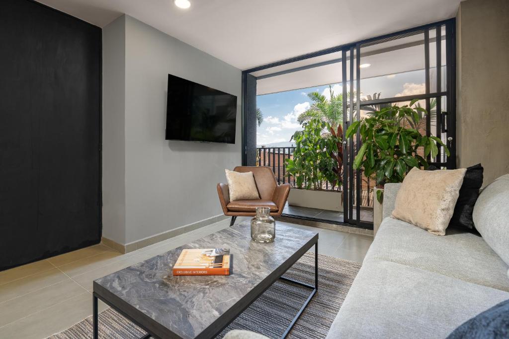a living room with a couch and a table at Park 38 in Envigado