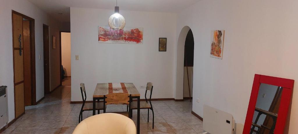 a dining room with a table and chairs at Avellaneda in Mendoza