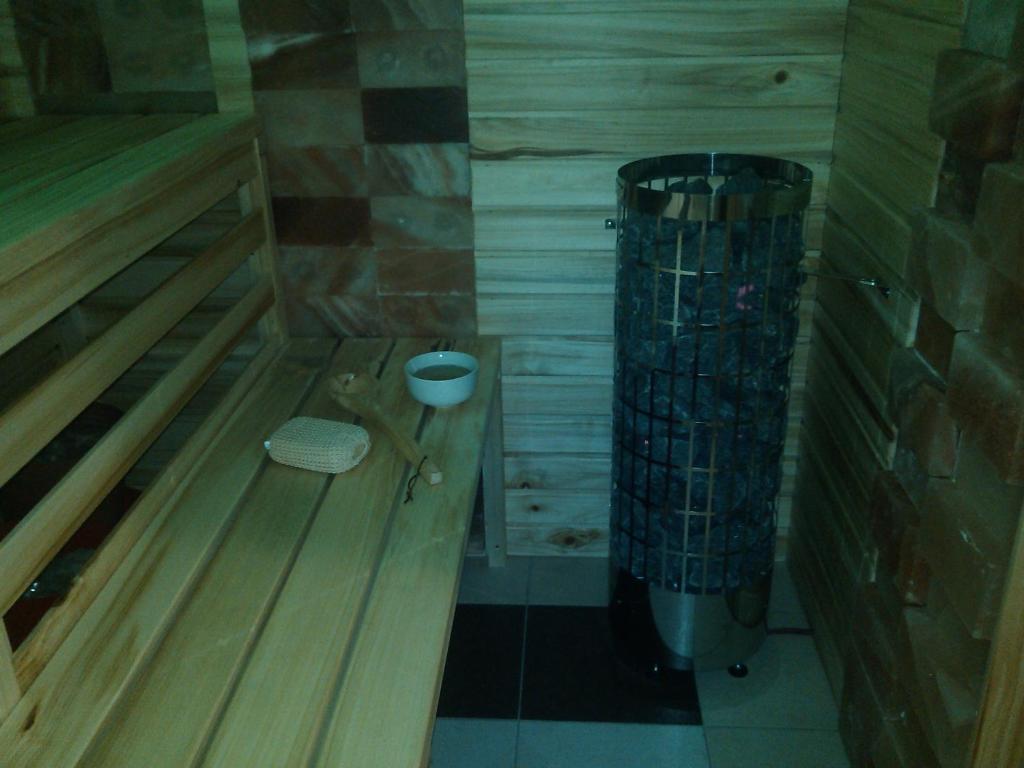 a small bathroom with a trash can in a room at Apartmány Kuřátko in Benecko