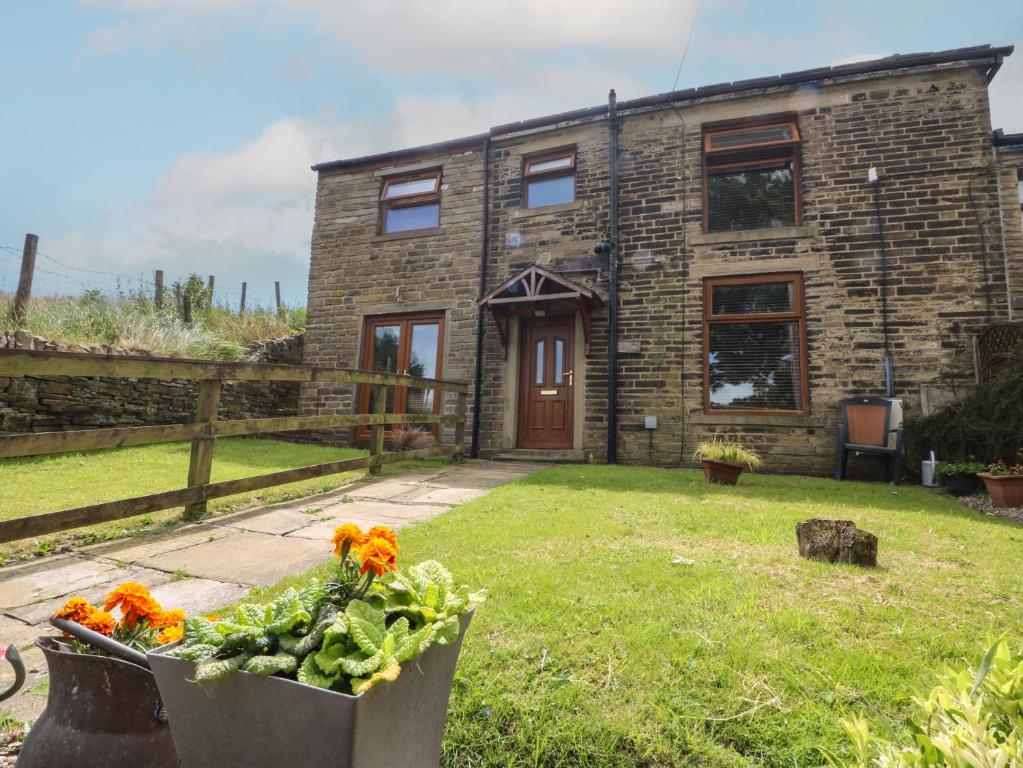 a house with a bunch of vegetables in front of it at Moscow Mews in Bradford