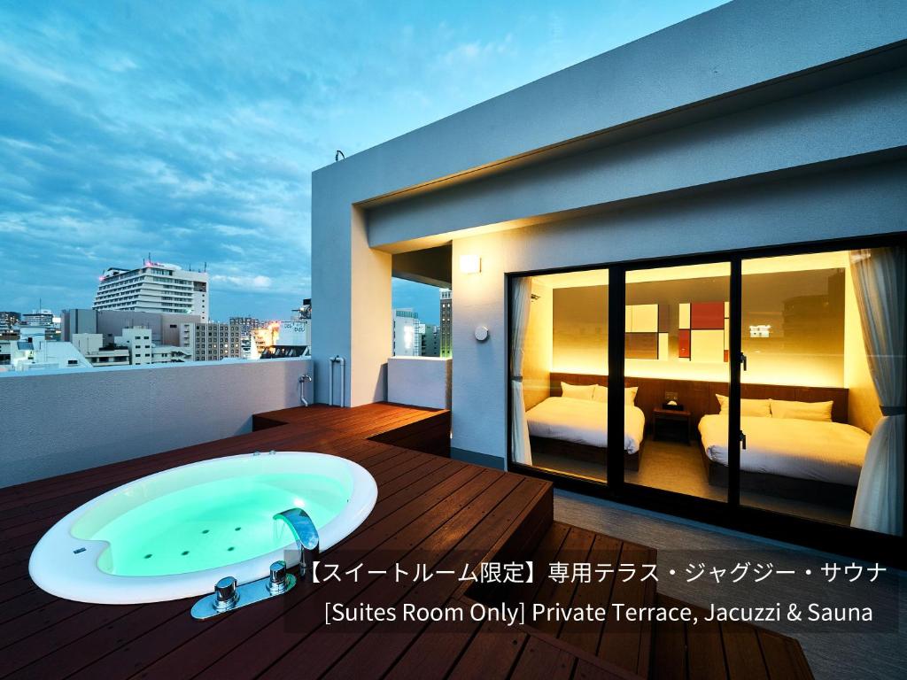 a bathroom with a bath tub on a balcony at LACER OKINAWA NAHA Miebashi in Naha