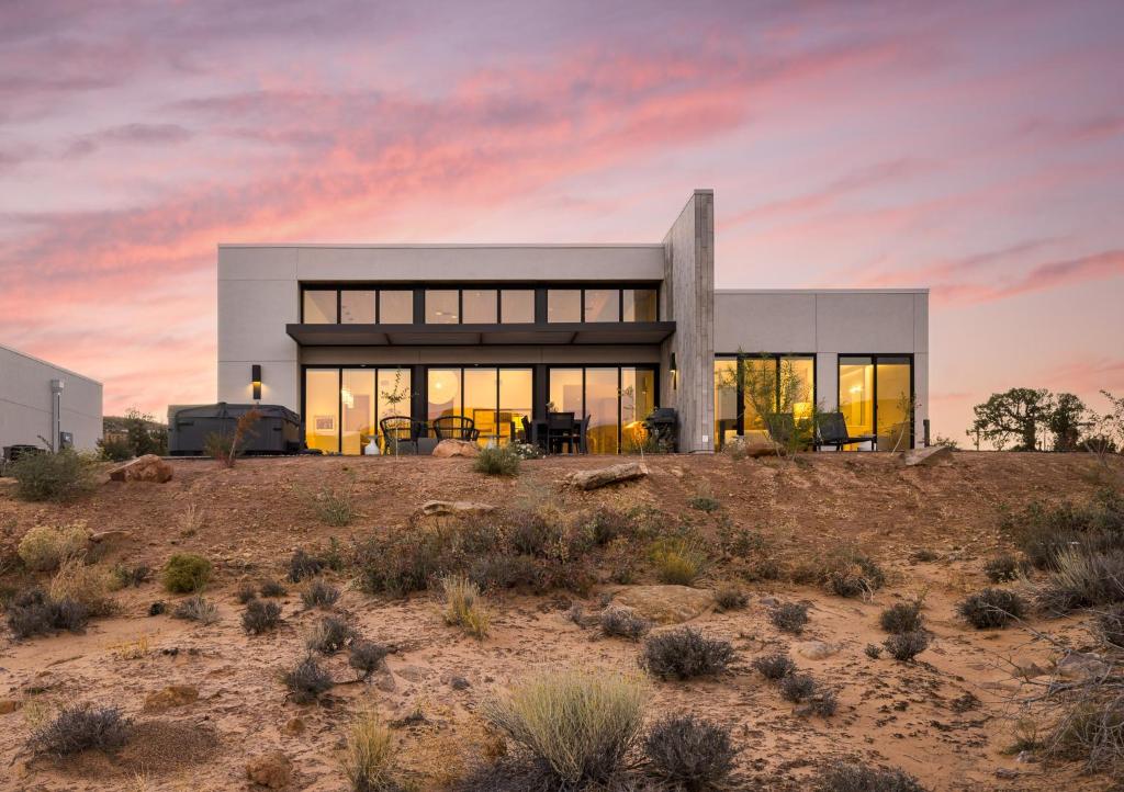 a house on top of a hill in the desert at LIONSBACK RESORT in Moab