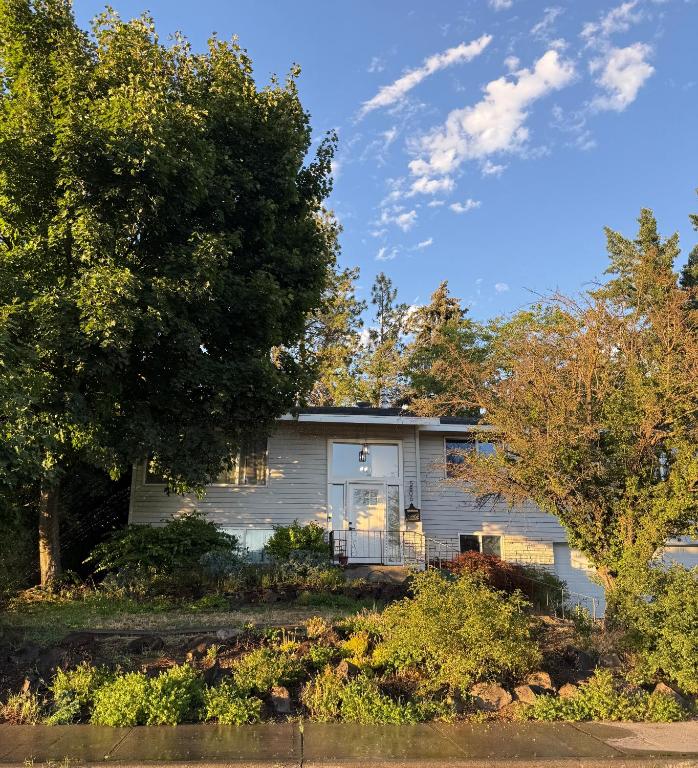 a house with a tree in front of it at Anthony's Home in Spokane