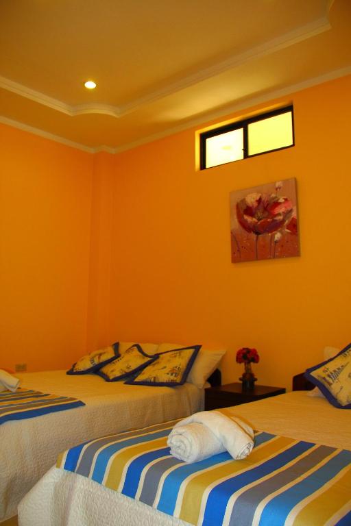 Postel nebo postele na pokoji v ubytování Hostal Duncan