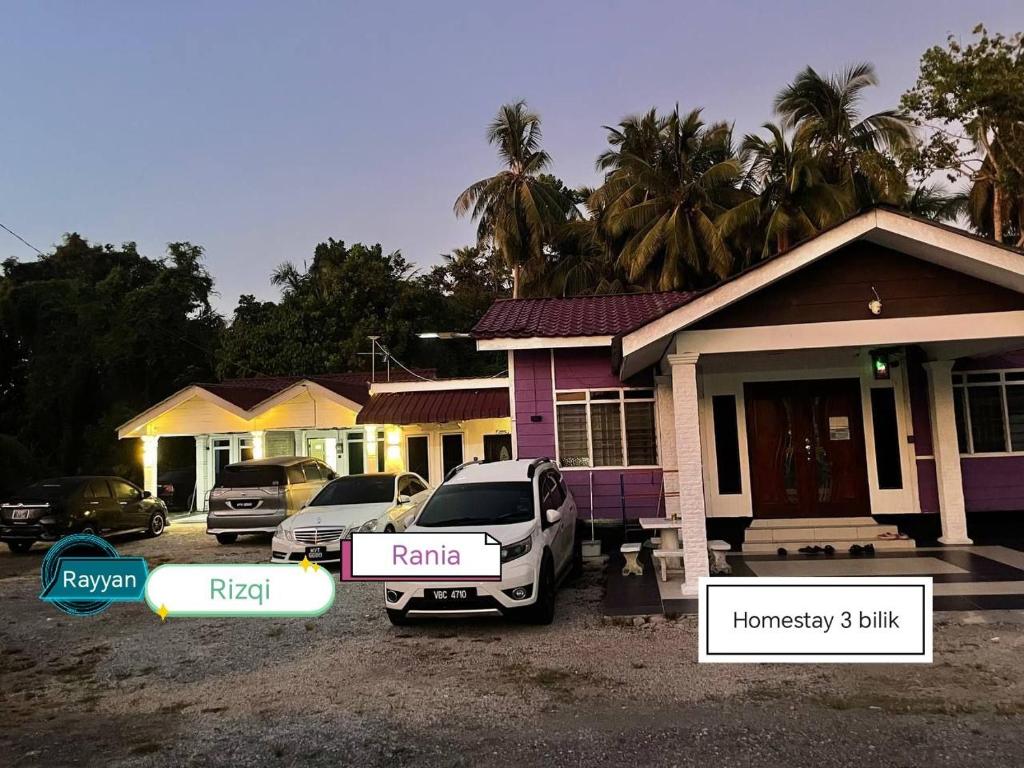 a car parked in front of a house at Ar Homestay Merlimau in Merlimau