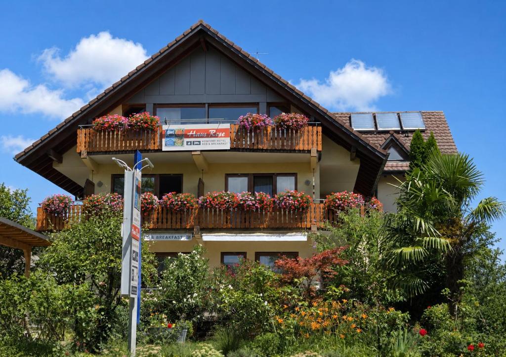 a building with flower boxes on the balconies at Haus Rose in Allensbach