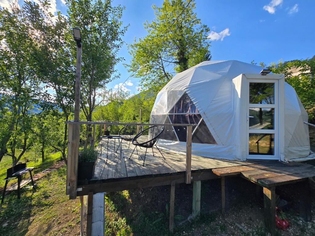 a yurt on a wooden platform with a light at Kamp Glamp Plivska Oaza in Jajce