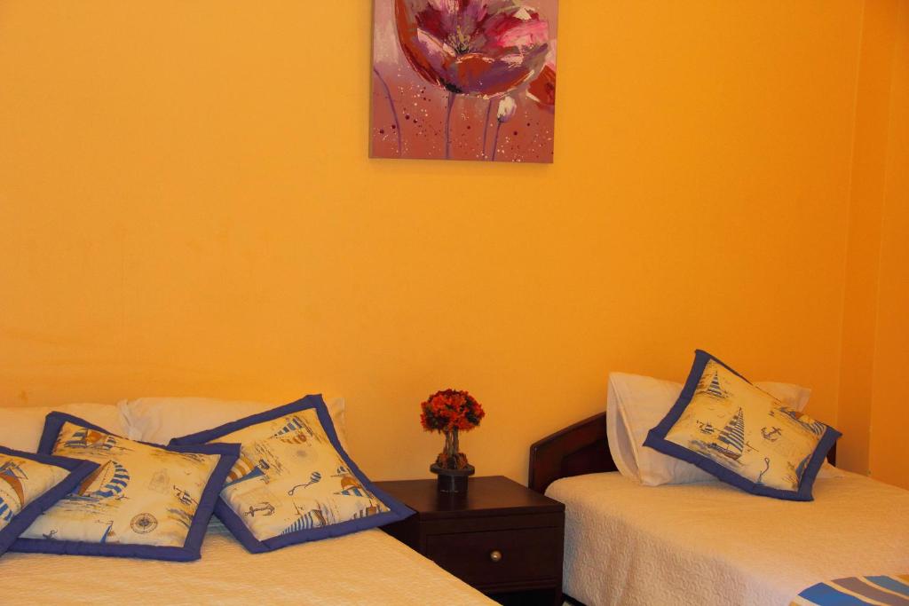 Postel nebo postele na pokoji v ubytování Hostal Duncan