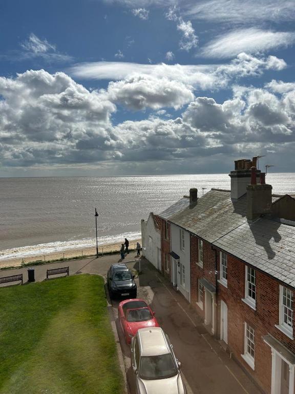 a view of the beach from the balcony of a house at Barley House, Sea and Beach Facing Accommodation in Southwold