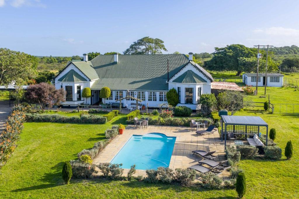 a house with a swimming pool in the yard at Kingston Farm in Bathurst