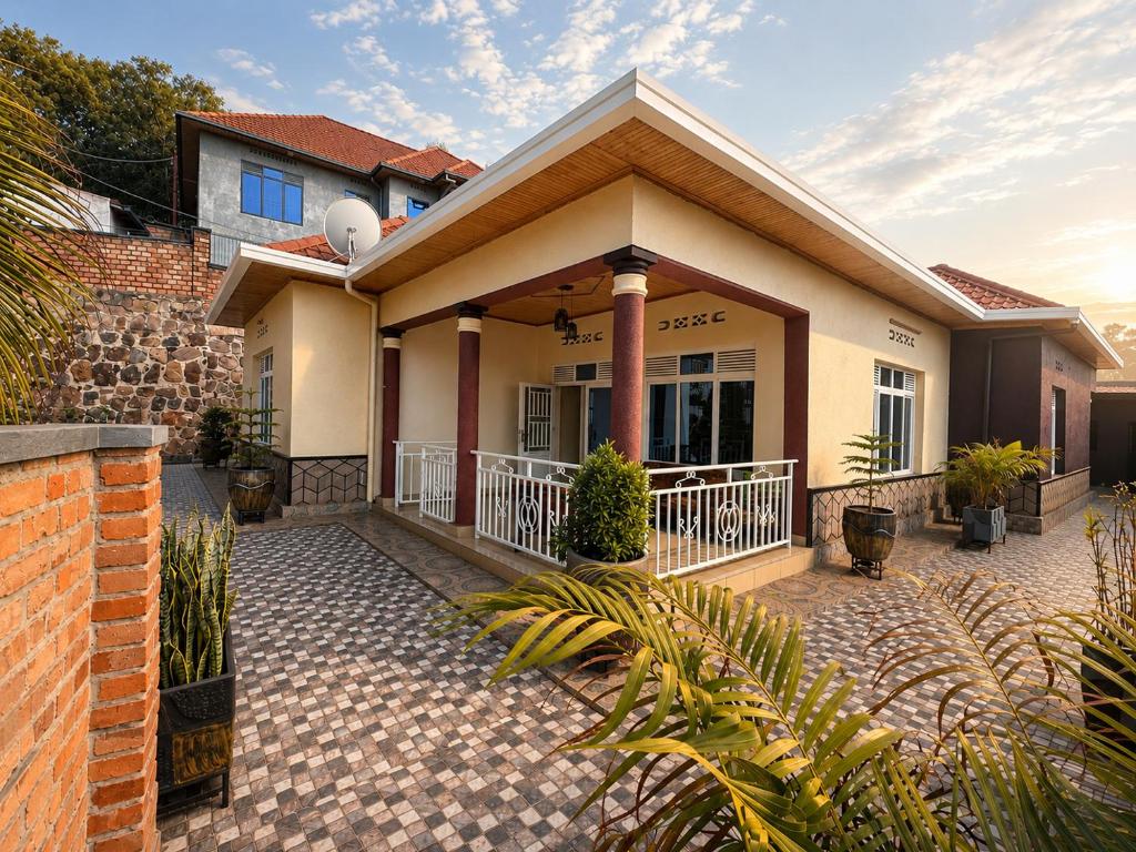 a house with a brick driveway in front of it at The Gathering in Kigali