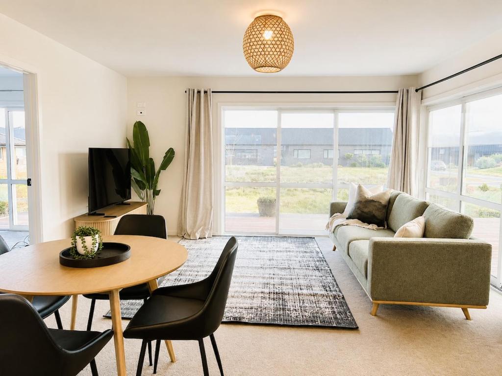 a living room with a couch and a table at The Burnby in Te Anau
