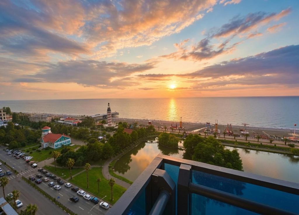 a view of the ocean from a balcony at sunset at Batumi Sky Palace in Batumi