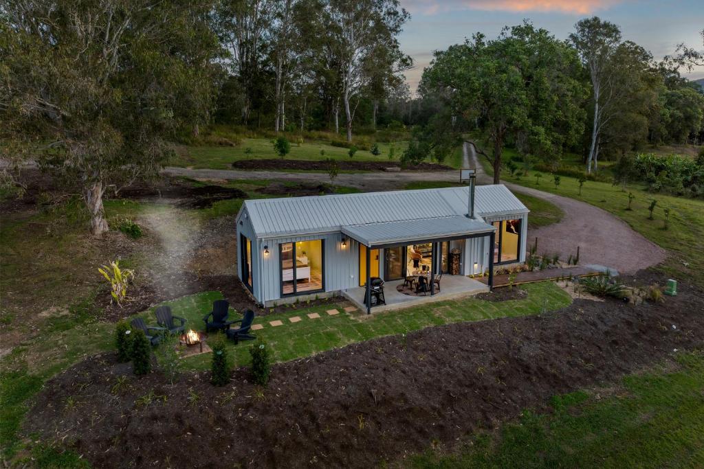 an overhead view of a tiny house in a field at Dundalli Lodge in Conondale