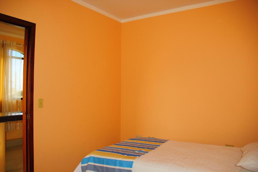 Postel nebo postele na pokoji v ubytování Hostal Duncan