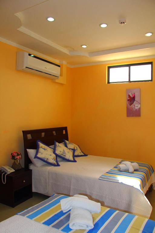 Postel nebo postele na pokoji v ubytování Hostal Duncan