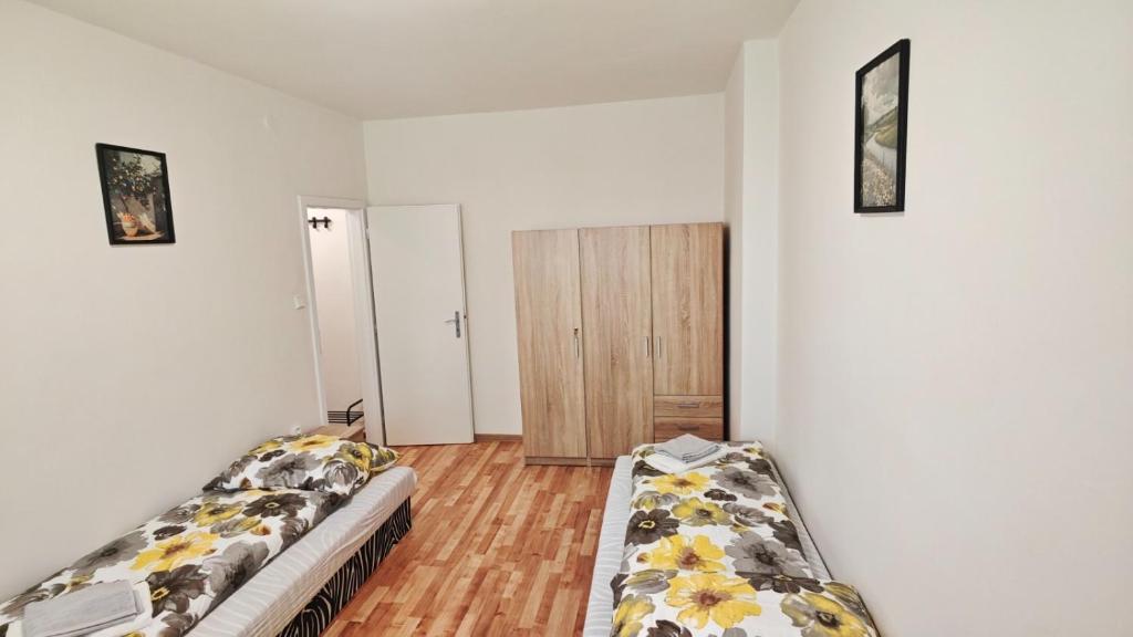a living room with two beds in a room at Apartmán pro 2 osoby, Bukovany B3 in Sokolov