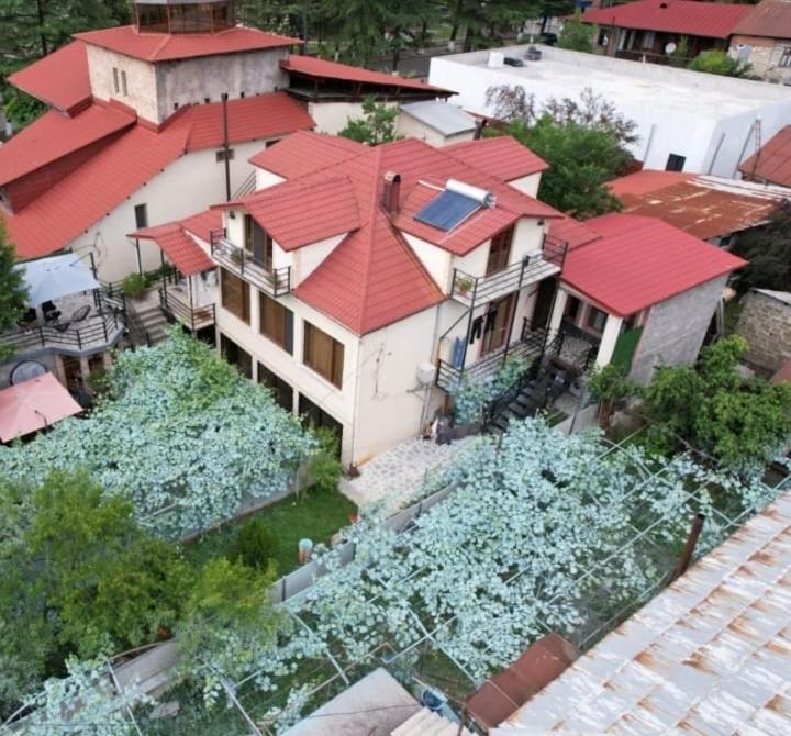 an aerial view of a house with a red roof at Gallery in Tsʼageri