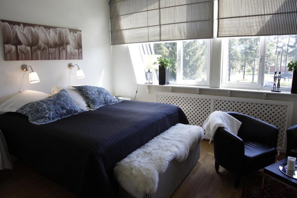Postel nebo postele na pokoji v ubytování Hotel Småland