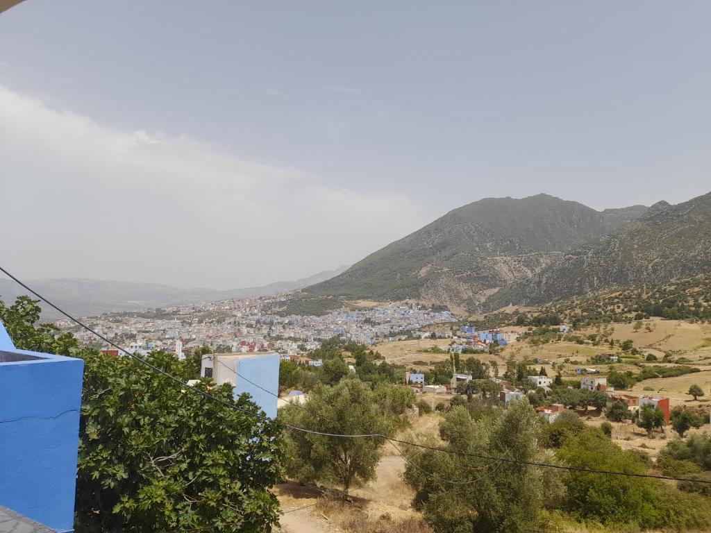 a view of a town in the mountains at Dar Salima in Chefchaouen