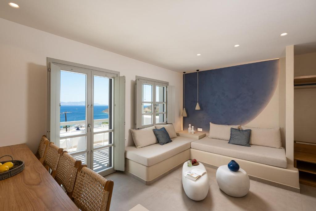 a living room with a couch and a table at Gea Perla Serifos in Livadi