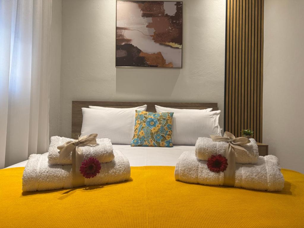 a bedroom with a bed with two boxes on it at Ancient Philippi Luxury Apt MKP in Krinídhes