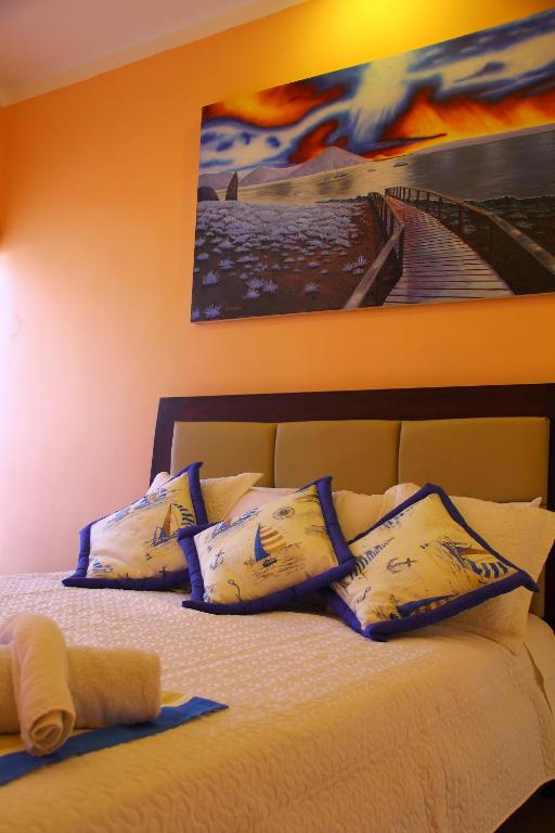 Postel nebo postele na pokoji v ubytování Hostal Duncan