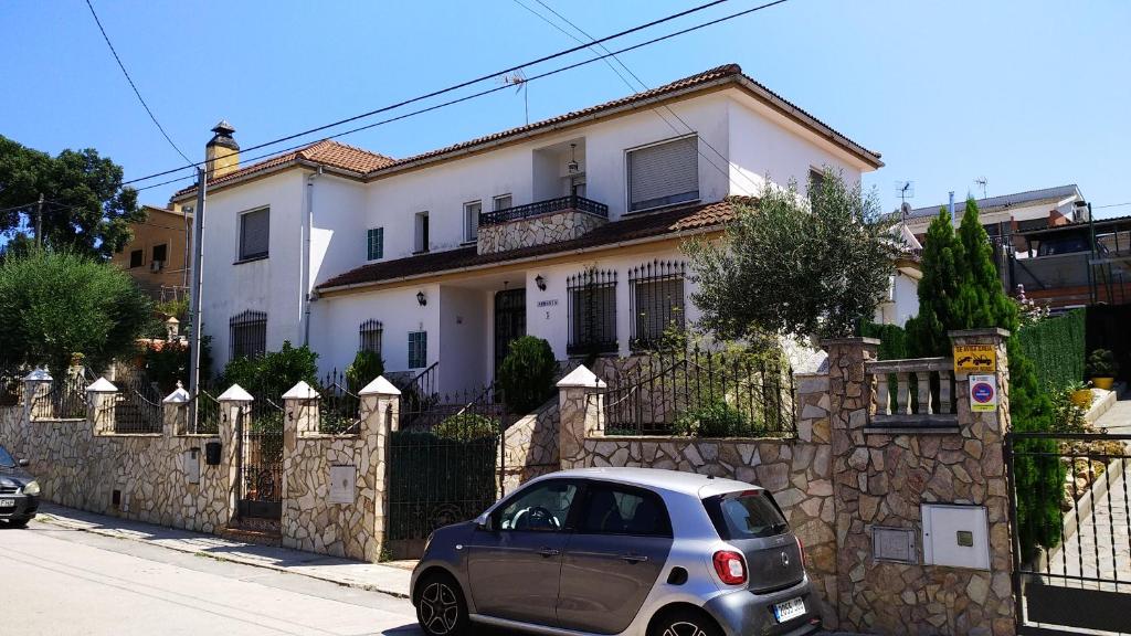 a small car parked in front of a house at Armonía in Tordera