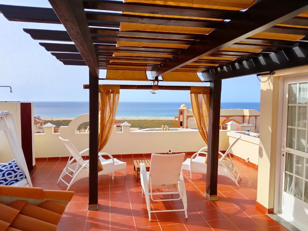 a patio with a view of the ocean at Casa Chalet El Bucanero Morro Jable in Morro del Jable