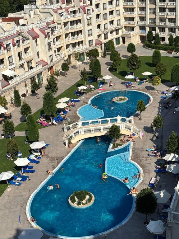 an overhead view of three pools in a resort at Видовые 2-комнатное апартаменты в комплексе Varna South Bay in Asparukhovo