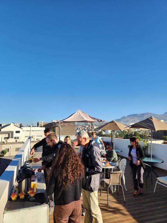 a group of people standing on top of a roof at Chikan Hoteles in Arequipa