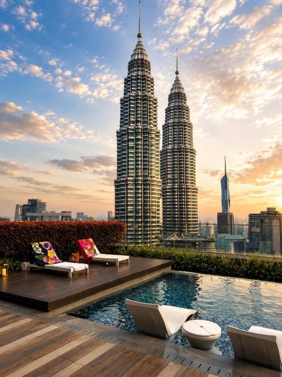 a view of the petronas twin towers from the rooftop of a building at GOLDEN Services Suites At Star KLCC in Kuala Lumpur