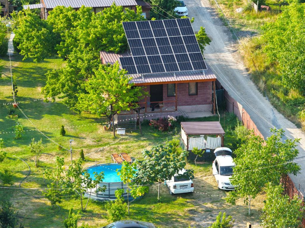 an aerial view of a house with solar panels on the roof at Noravank L-and-L in Aghavnadzor