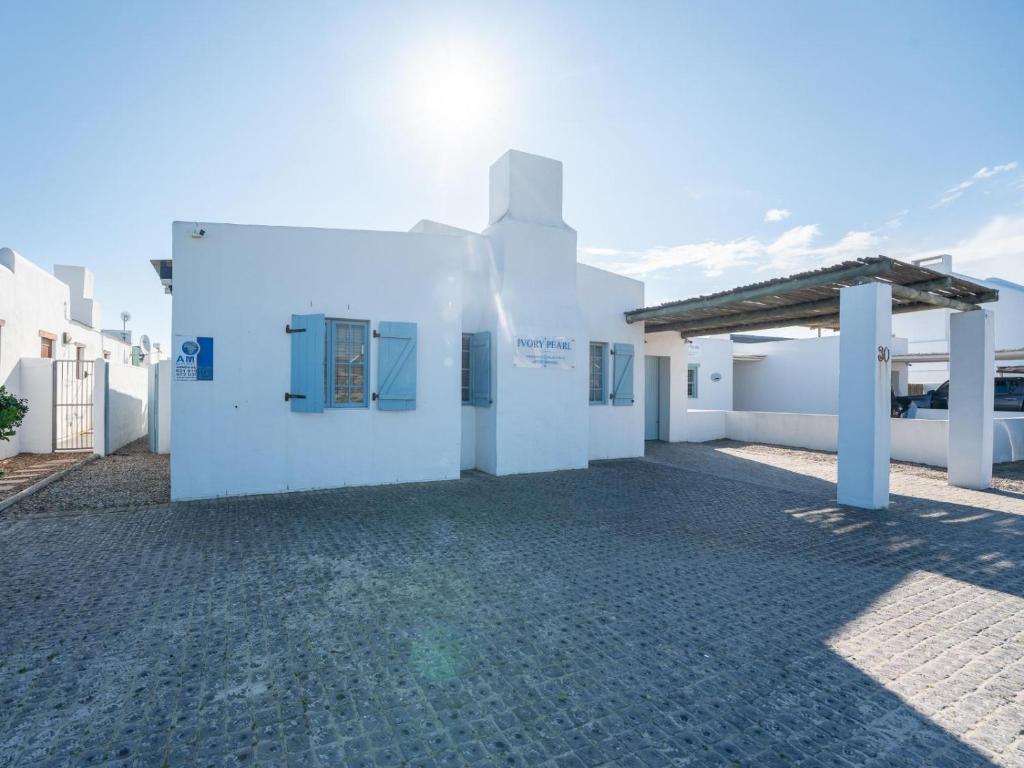a rendering of a white building with a roof at Ivory Pearl in Paternoster